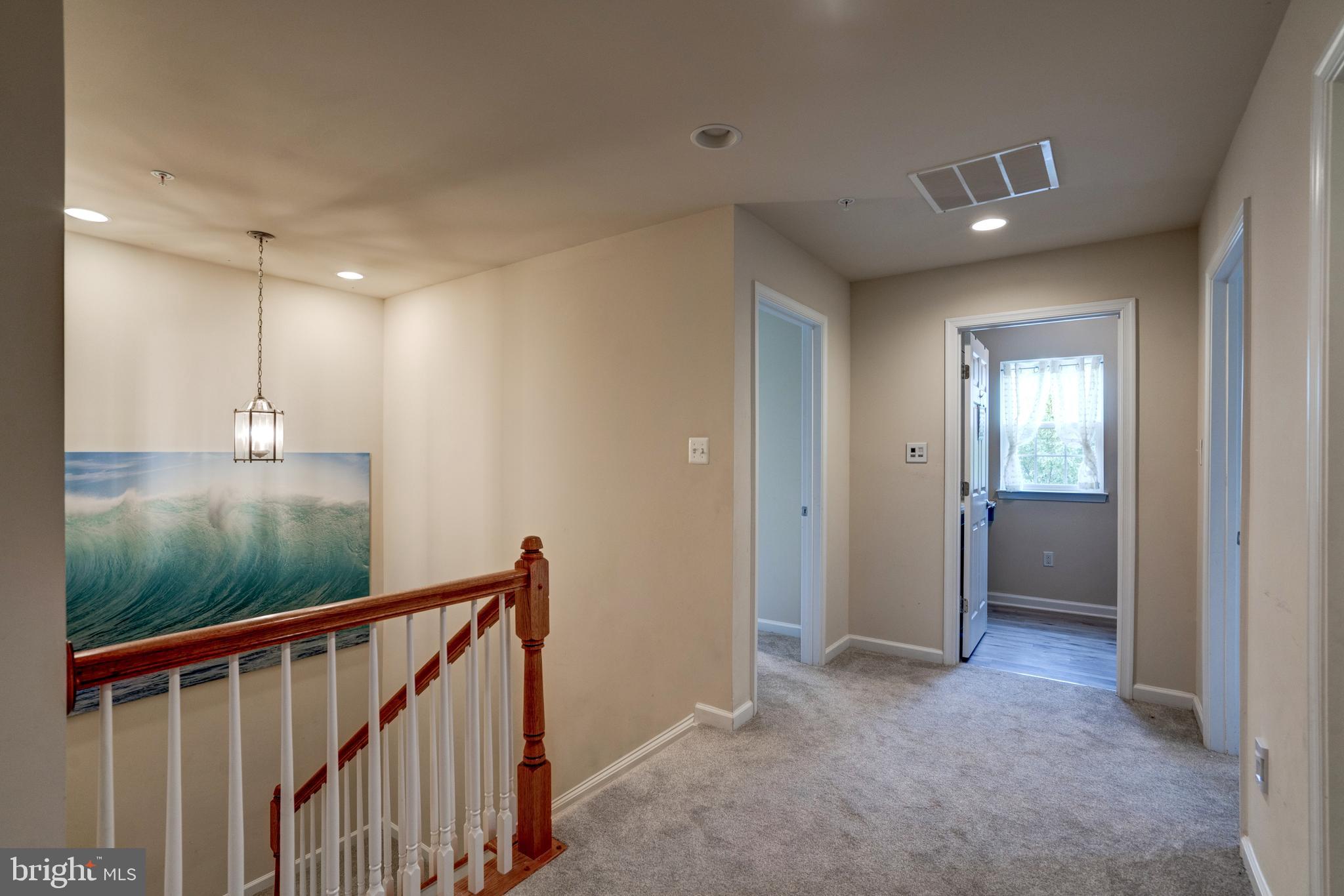 11516 Amherst Avenue Silver Spring, MD 20902 - Photo 18 of 38 Light filled open second floor hallway