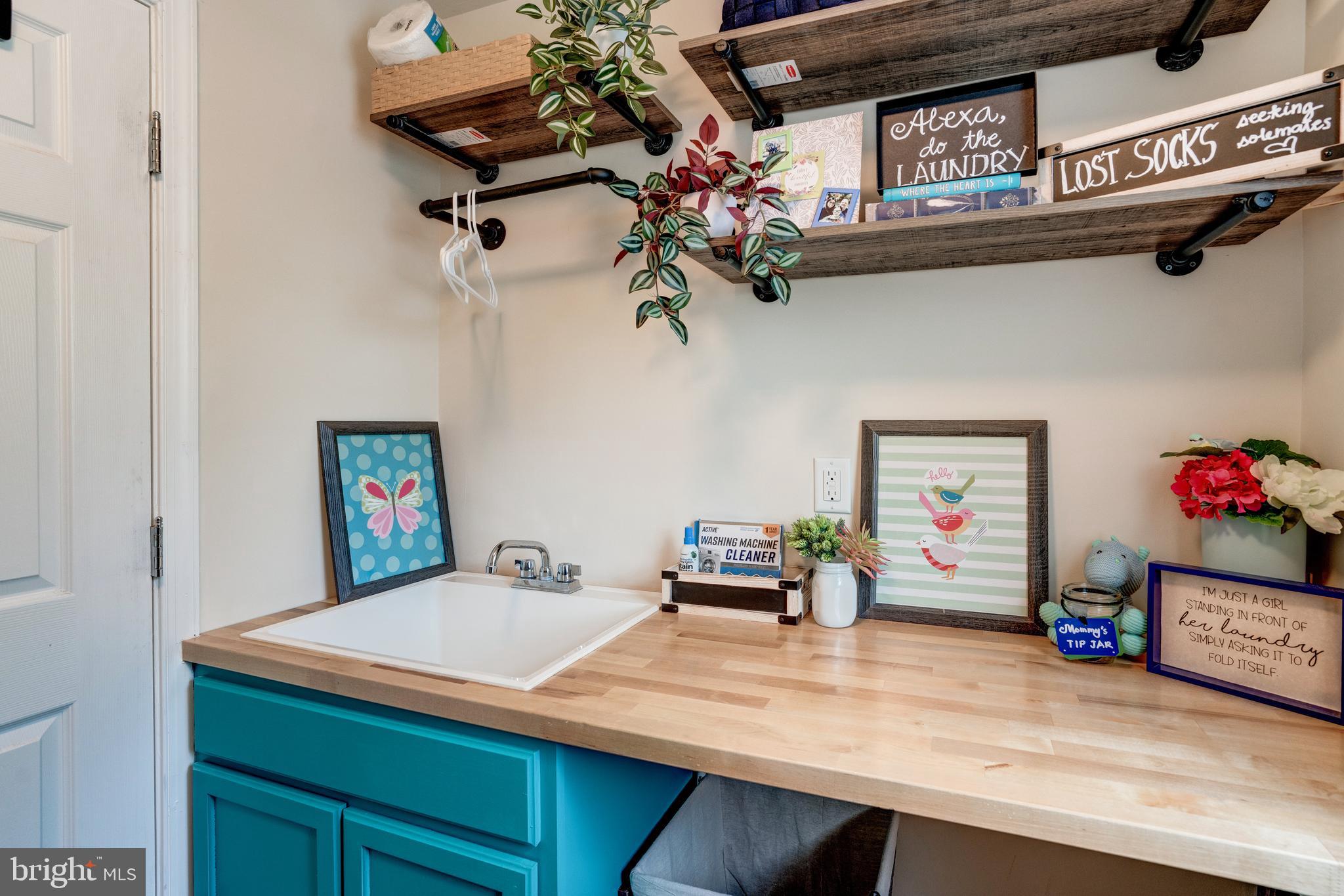 11516 Amherst Avenue Silver Spring, MD 20902 - Photo 30 of 38 Second floor wash room w/sink, folding table