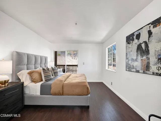a bedroom with bed and window
