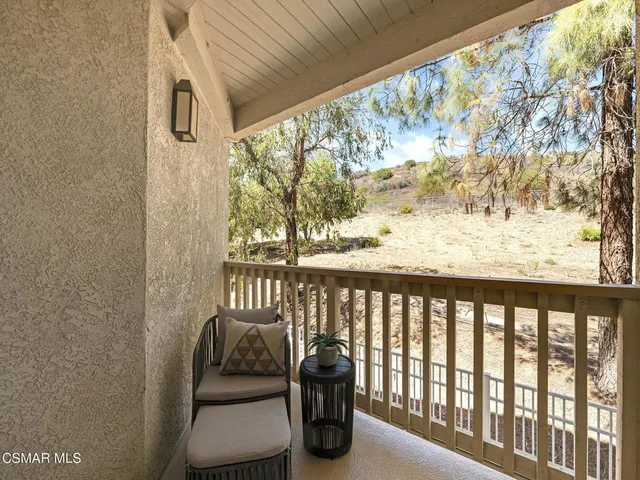a view of a porch with furniture