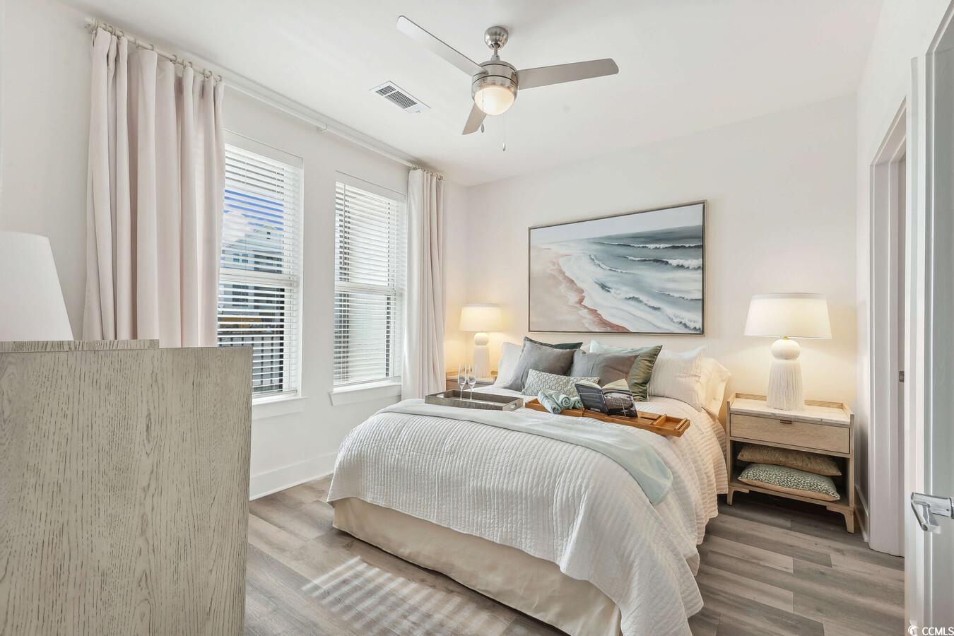 331 Pickwick Drive, Unit A2 Myrtle Beach, SC 29588 - Photo 16 of 39 Bedroom with light hardwood / wood-style flooring and ceiling fan