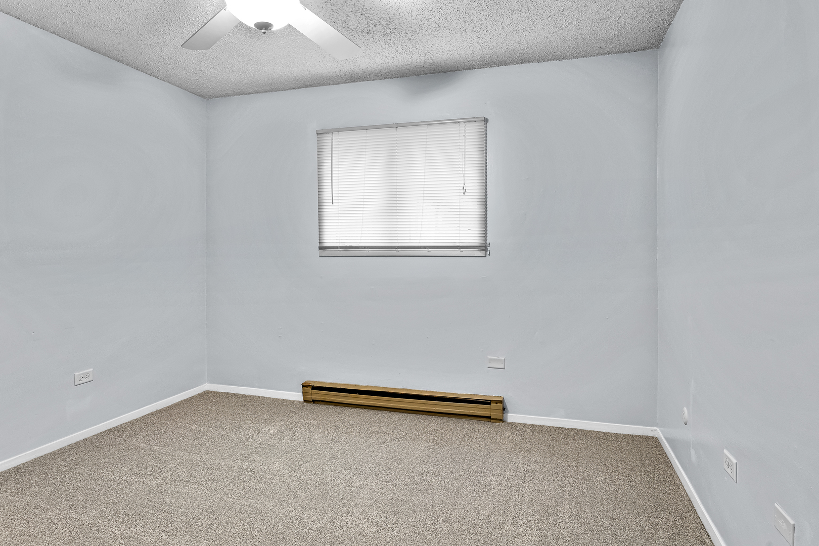 216 Madison Street, Unit 1A Joliet, IL 60435 - Photo 11 of 13 an empty room with a window