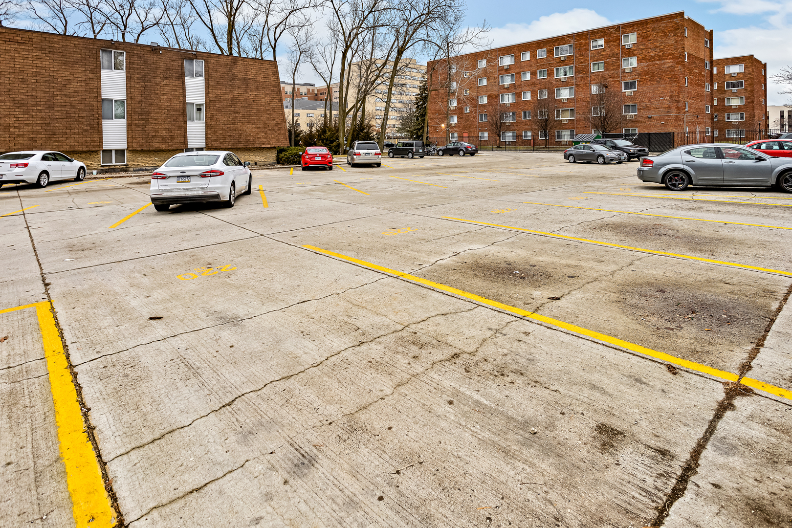 216 Madison Street, Unit 1A Joliet, IL 60435 - Photo 2 of 13 a car parked on the side of a street