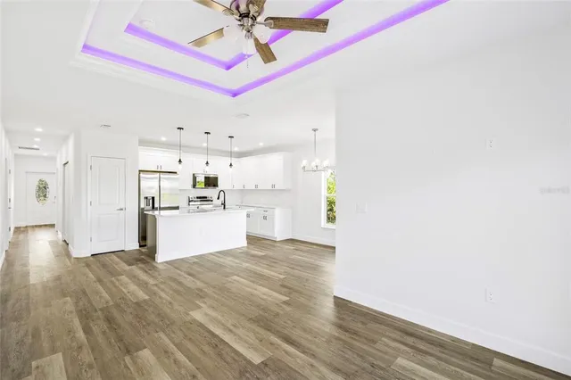 a view of a kitchen with wooden floor