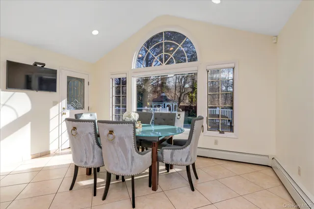 a view of a dining room with furniture window and outside view