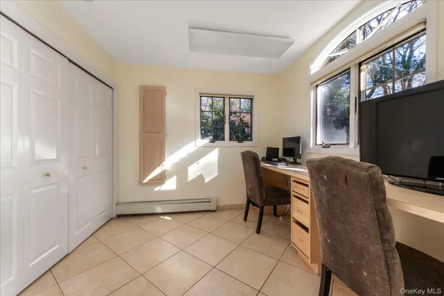 a workspace with furniture and window