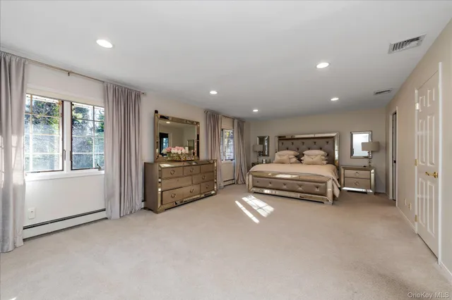 a bedroom with furniture and a window