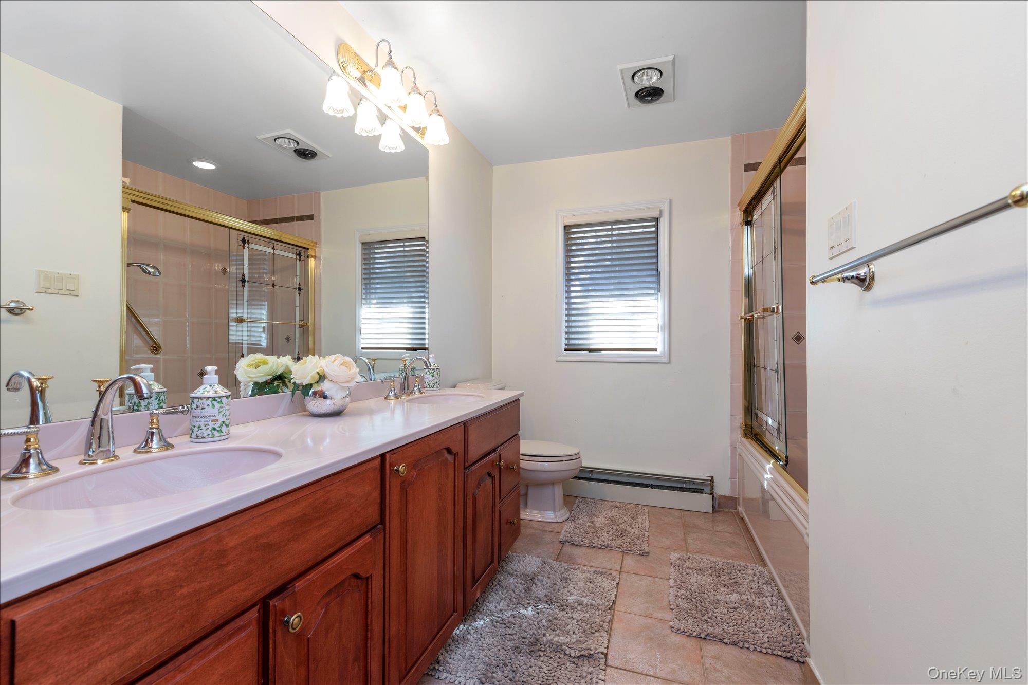 200 Hummingbird Drive East Hills, NY 11576 - Photo 21 of 29 a bathroom with a sink double vanity and a mirror