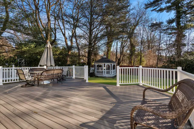 a view of a roof deck with wooden fence and floor