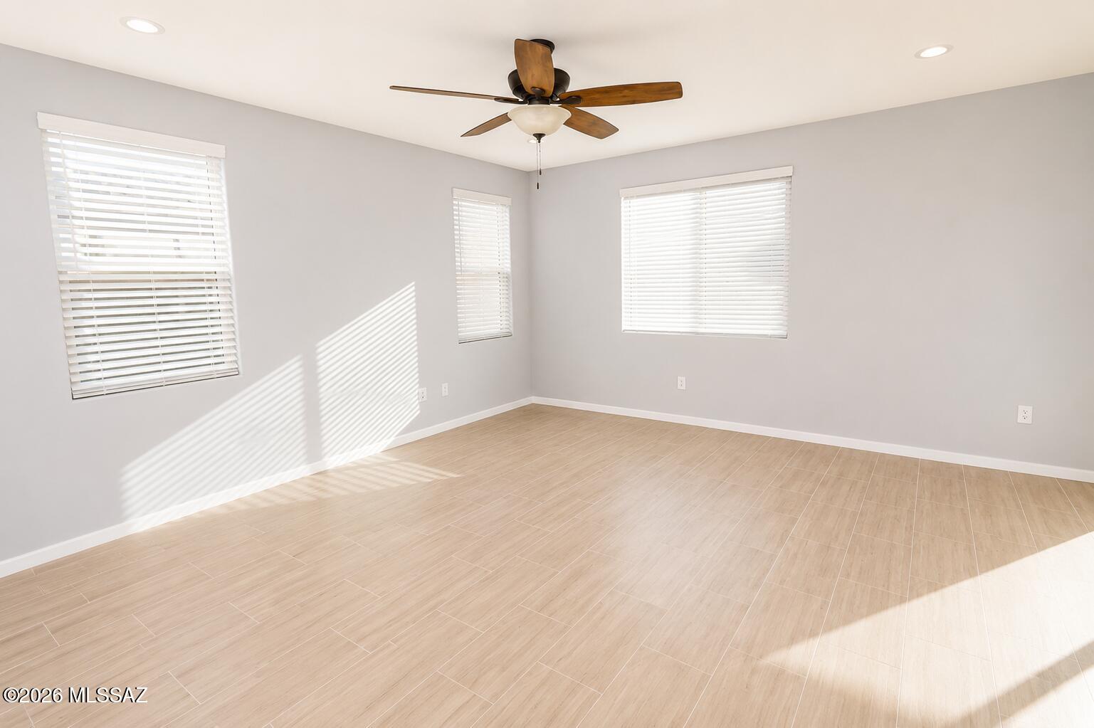 11484 East Desert Raptor Loop Tucson, AZ 85747 - Photo 26 of 28 a view of a room with a window and a ceiling fan