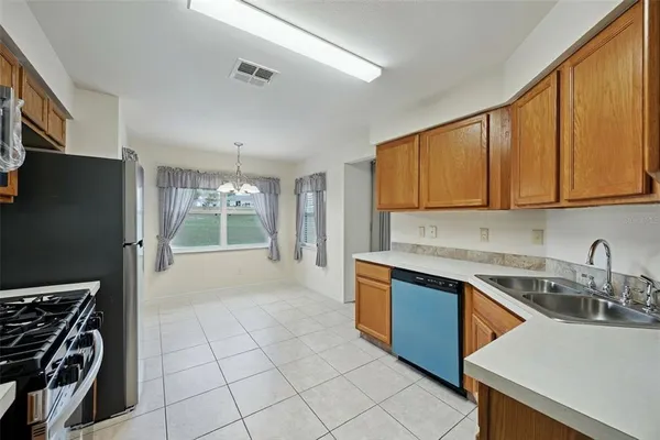 a kitchen that has a sink and a stove