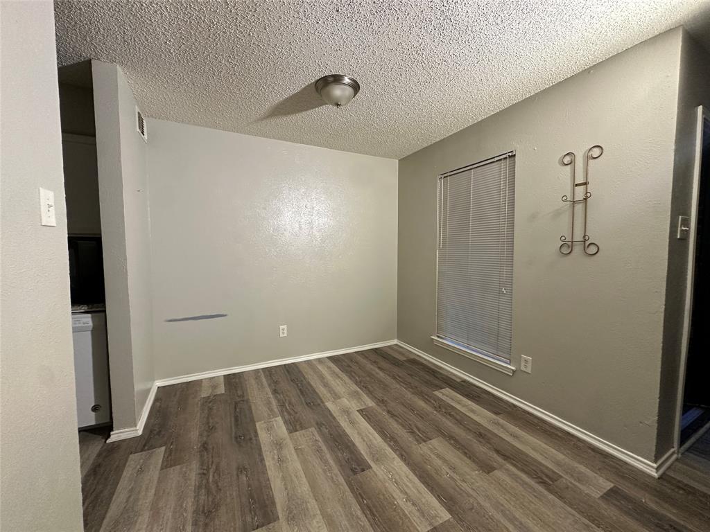 8109 Skillman Street, Unit 2007 Dallas, TX 75231 - Photo 11 of 25 a view of room with walk in closet and wooden floor