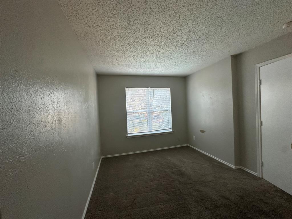 8109 Skillman Street, Unit 2007 Dallas, TX 75231 - Photo 12 of 25 an empty room with a window