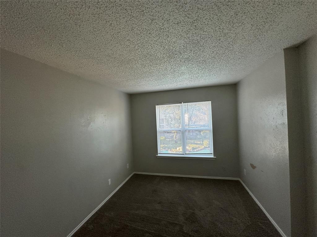 8109 Skillman Street, Unit 2007 Dallas, TX 75231 - Photo 13 of 25 an empty room with a window