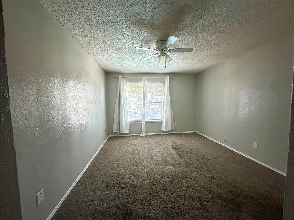 8109 Skillman Street, Unit 2007 Dallas, TX 75231 - Photo 15 of 25 an empty room with a empty space and windows