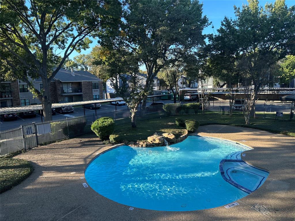 8109 Skillman Street, Unit 2007 Dallas, TX 75231 - Photo 18 of 25 a view of a swimming pool with a patio
