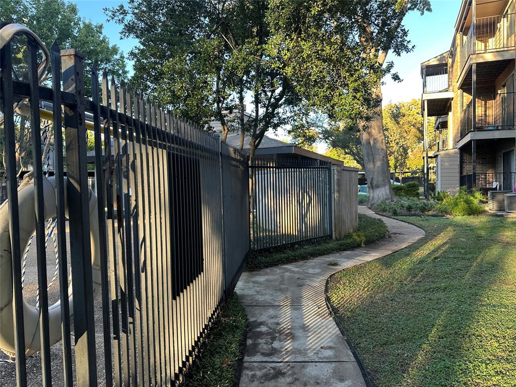 8109 Skillman Street, Unit 2007 Dallas, TX 75231 - Photo 21 of 25 a view of a house with a yard