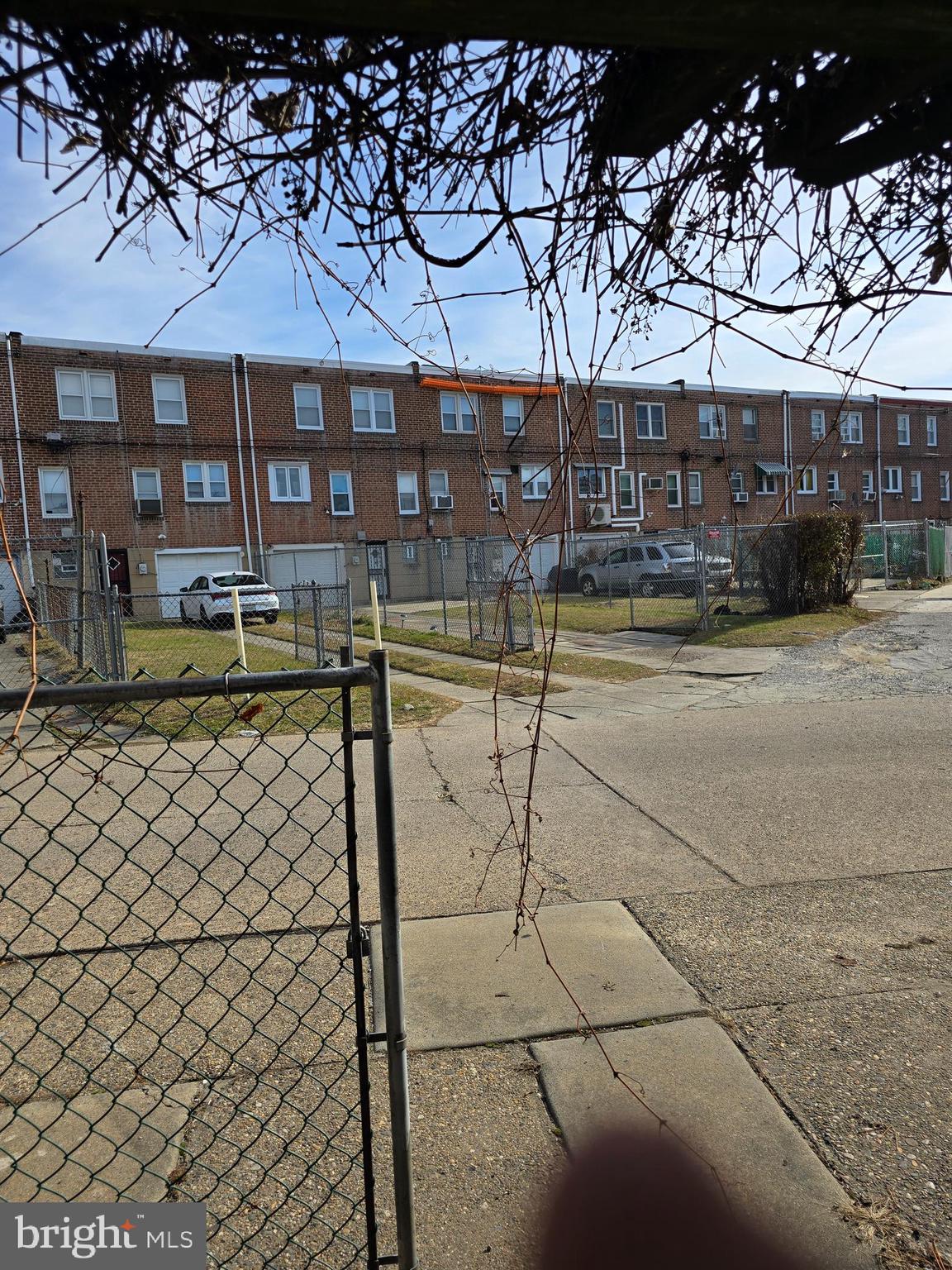 2204 East Washington Lane Philadelphia, PA 19138 - Photo 31 of 31 a front view of a building with a bench