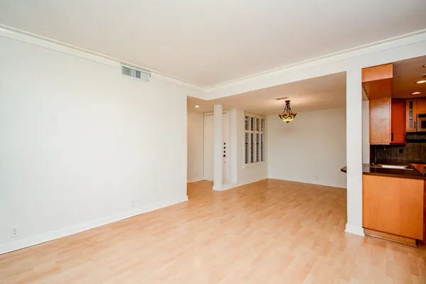 a view of a room with a ceiling fan and a window