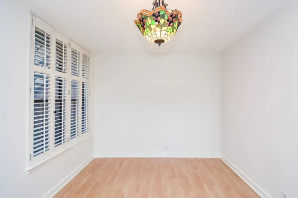 a view of a room with a chandelier and fireplace