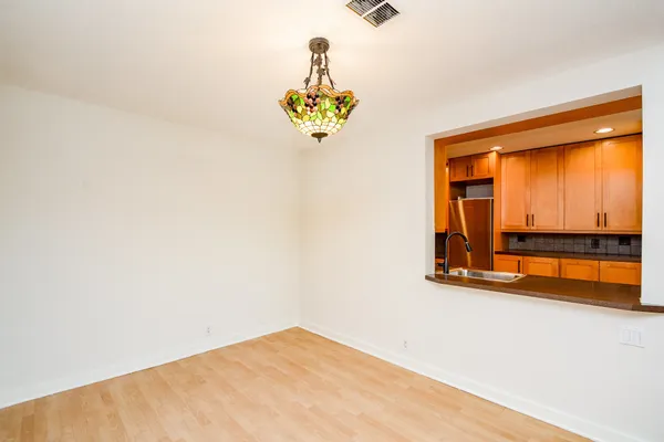 a kitchen with stainless steel appliances granite countertop a sink and a stove