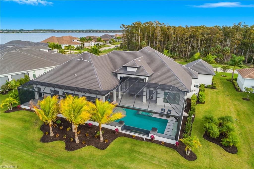 18410 Blue Eye Loop Fort Myers, FL 33913 - Photo 3 of 49 Enjoy nearly 1900 sq.ft. of outdoor living space with multiple fire features and outdoor living zones create inviting spaces to unwind, dine, or entertain year-round.