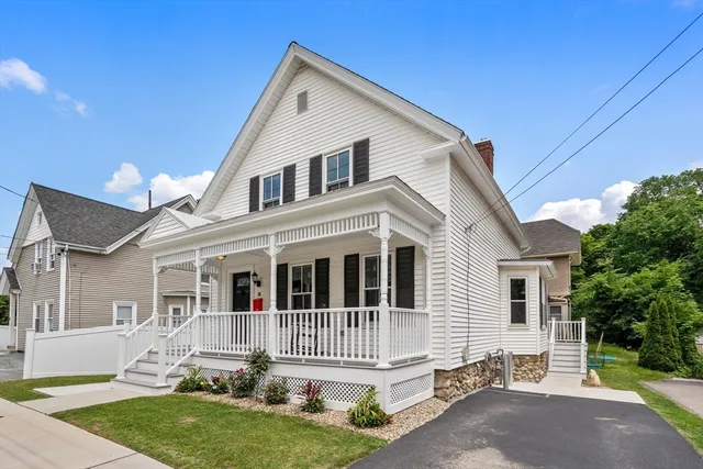 a front view of a house with a garden