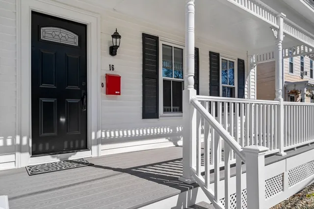 a porch with view of front door