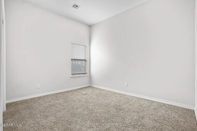 a kitchen with stainless steel appliances a refrigerator and a stove top oven