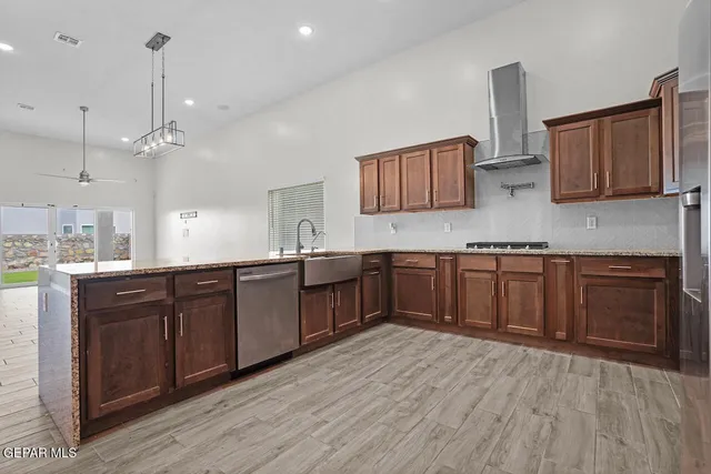 an empty room with window and wooden floor