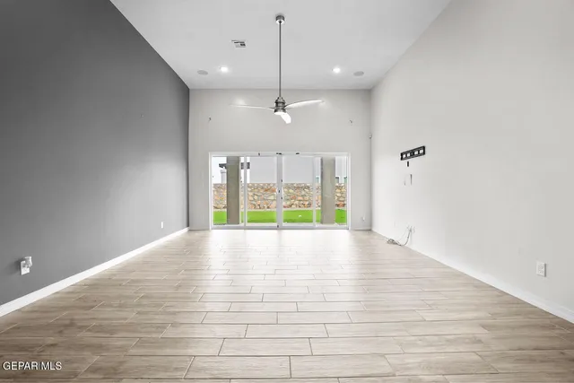 a view of a kitchen with a sink and a chandelier