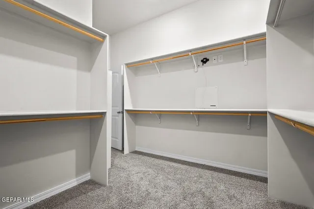 a view of a house with a yard and garden