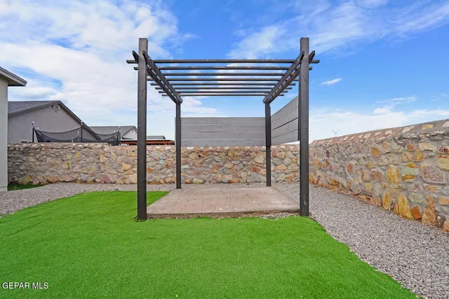 a view of a back yard of the house