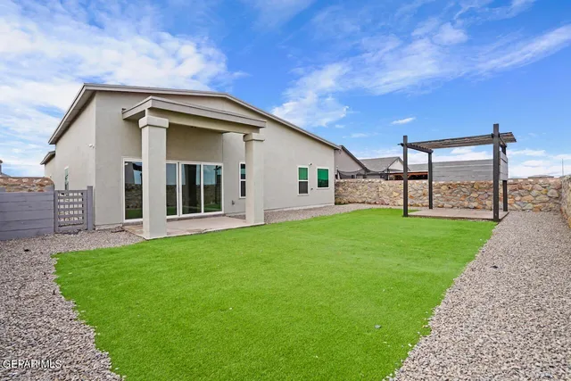 an aerial view of a kitchen with kitchen island stainless steel appliances and living room view