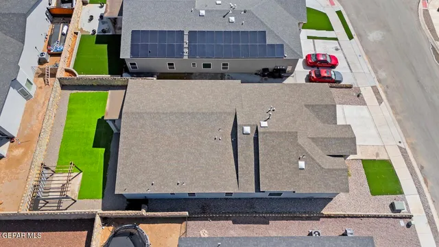 an aerial view of a house with a swimming pool