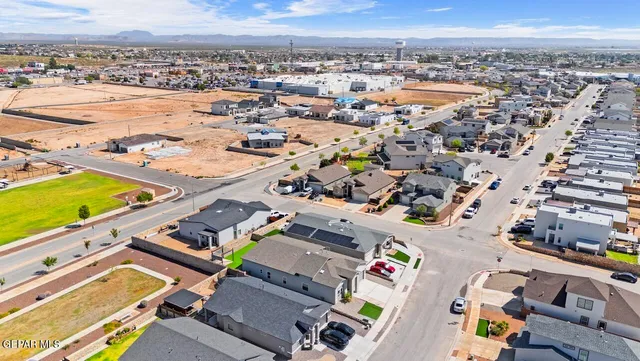 an aerial view of a house with a swimming pool