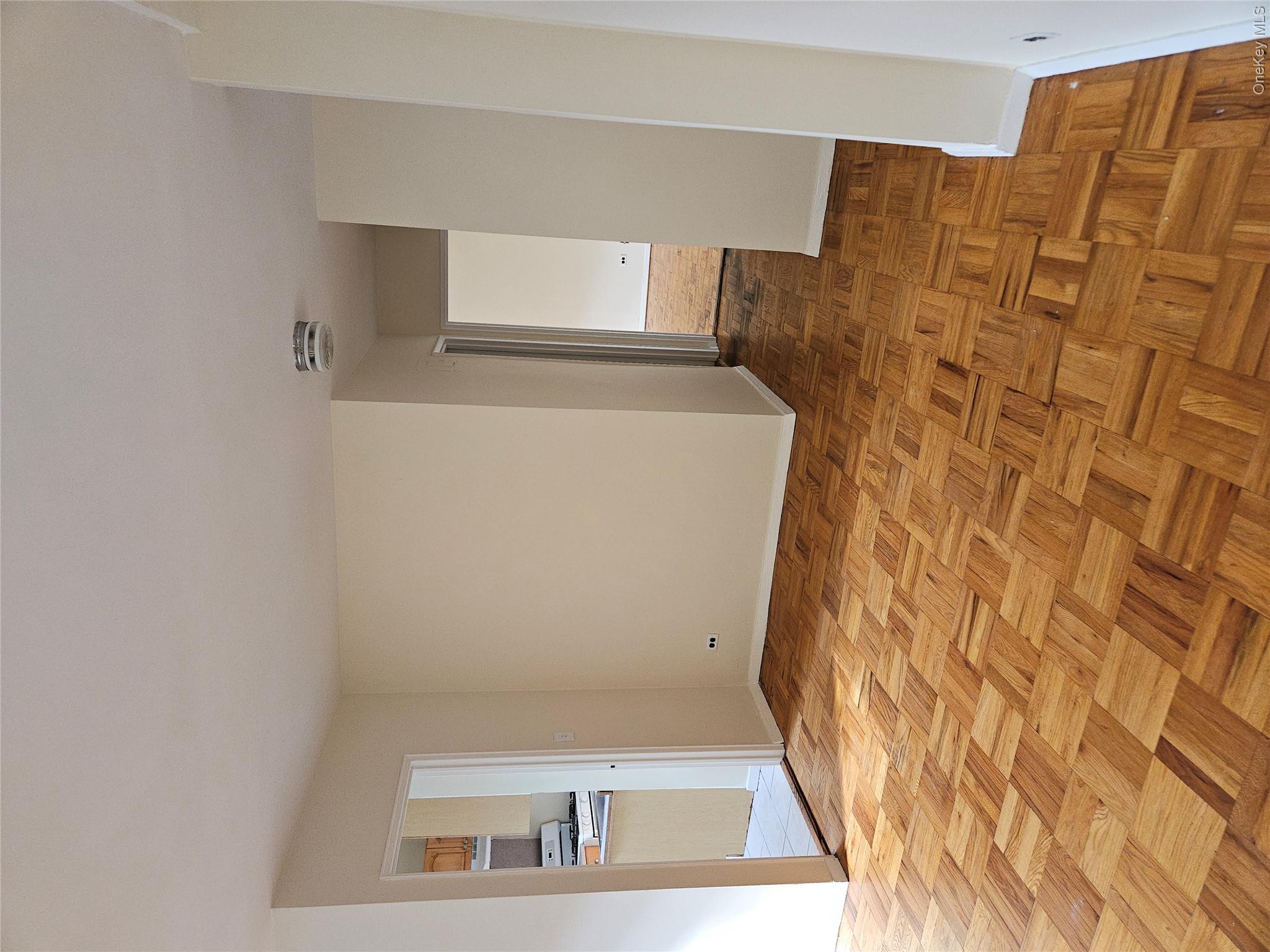 5500 Fieldston Road, Unit 4II Bronx, NY 10471 - Photo 5 of 15 Living room looking toward the kitchen and hallway.