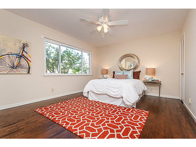 2 Rio Court Burlingame, CA 94010 - Photo 17 of 25 a bedroom with a bed and a chandelier