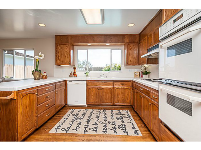 2 Rio Court Burlingame, CA 94010 - Photo 8 of 25 a kitchen with a stove a sink and a microwave