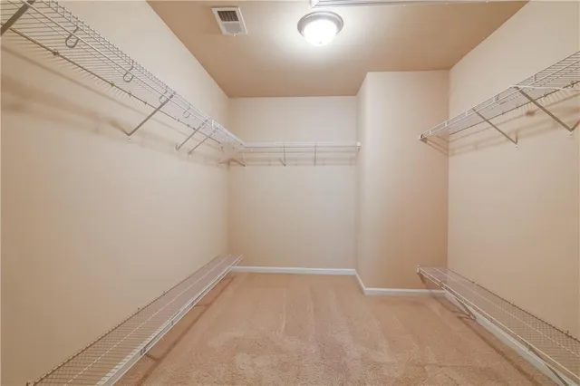 a balcony with wooden floor and fence