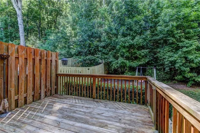 a view of a wooden door with a bench