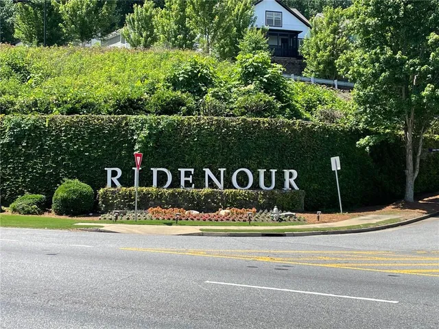 a view of a backyard with a swimming pool