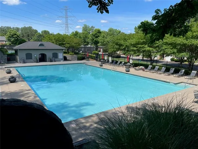 a view of a house with a tree in a yard