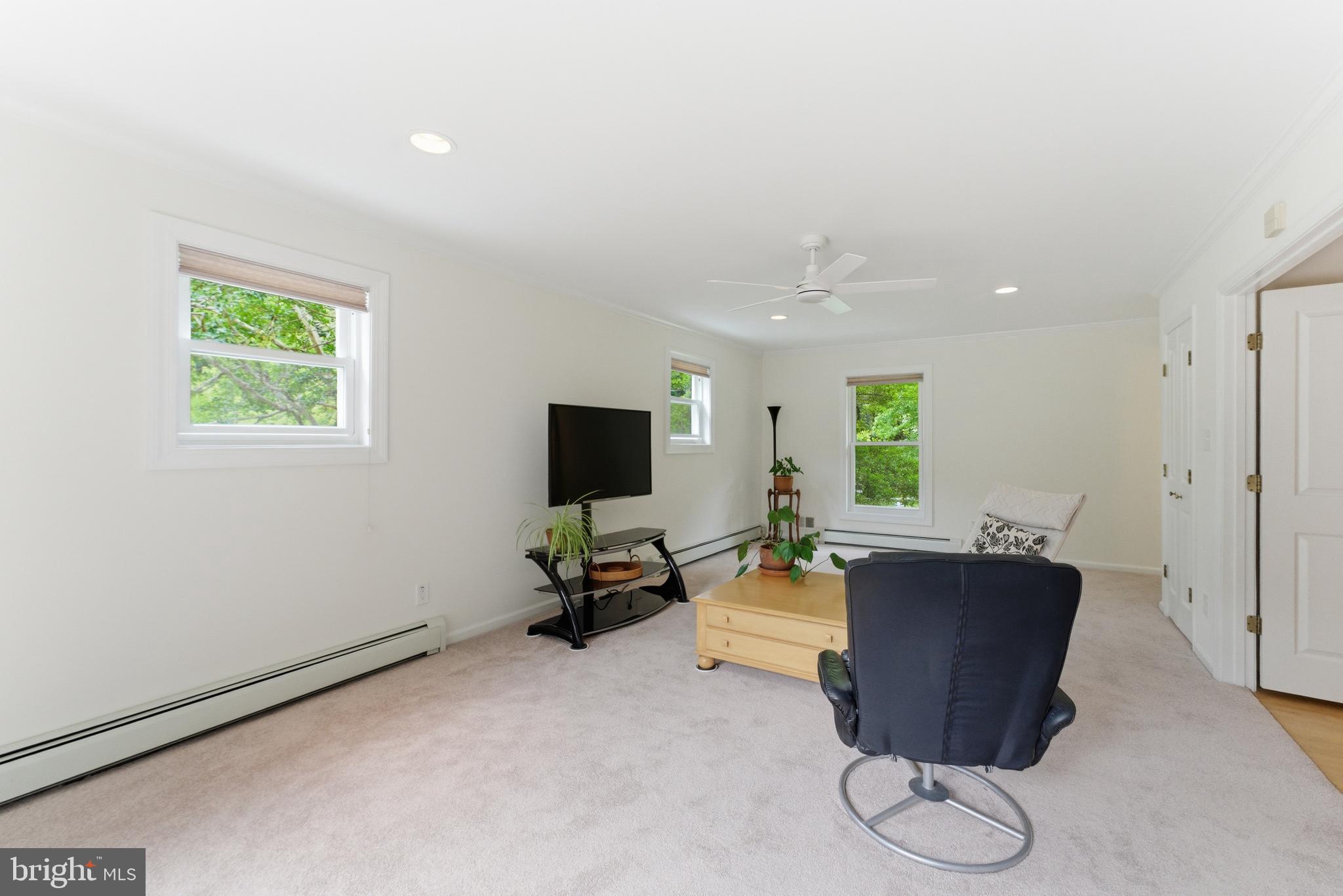 2100 Edgewater Parkway Silver Spring, MD 20903 - Photo 16 of 46 a living room with furniture a flat screen tv and a window