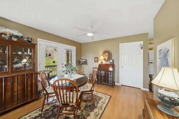 a dining room with furniture and window
