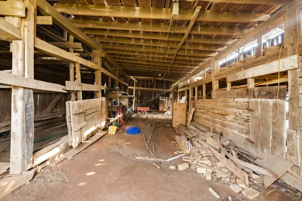 a view of a storage room with wooden shelves