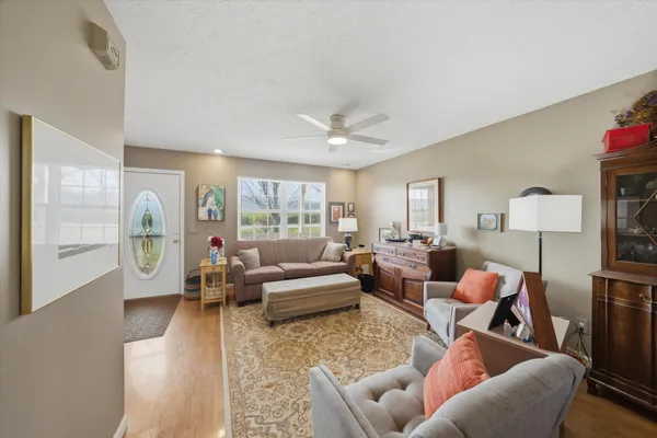 a living room with furniture and a large window