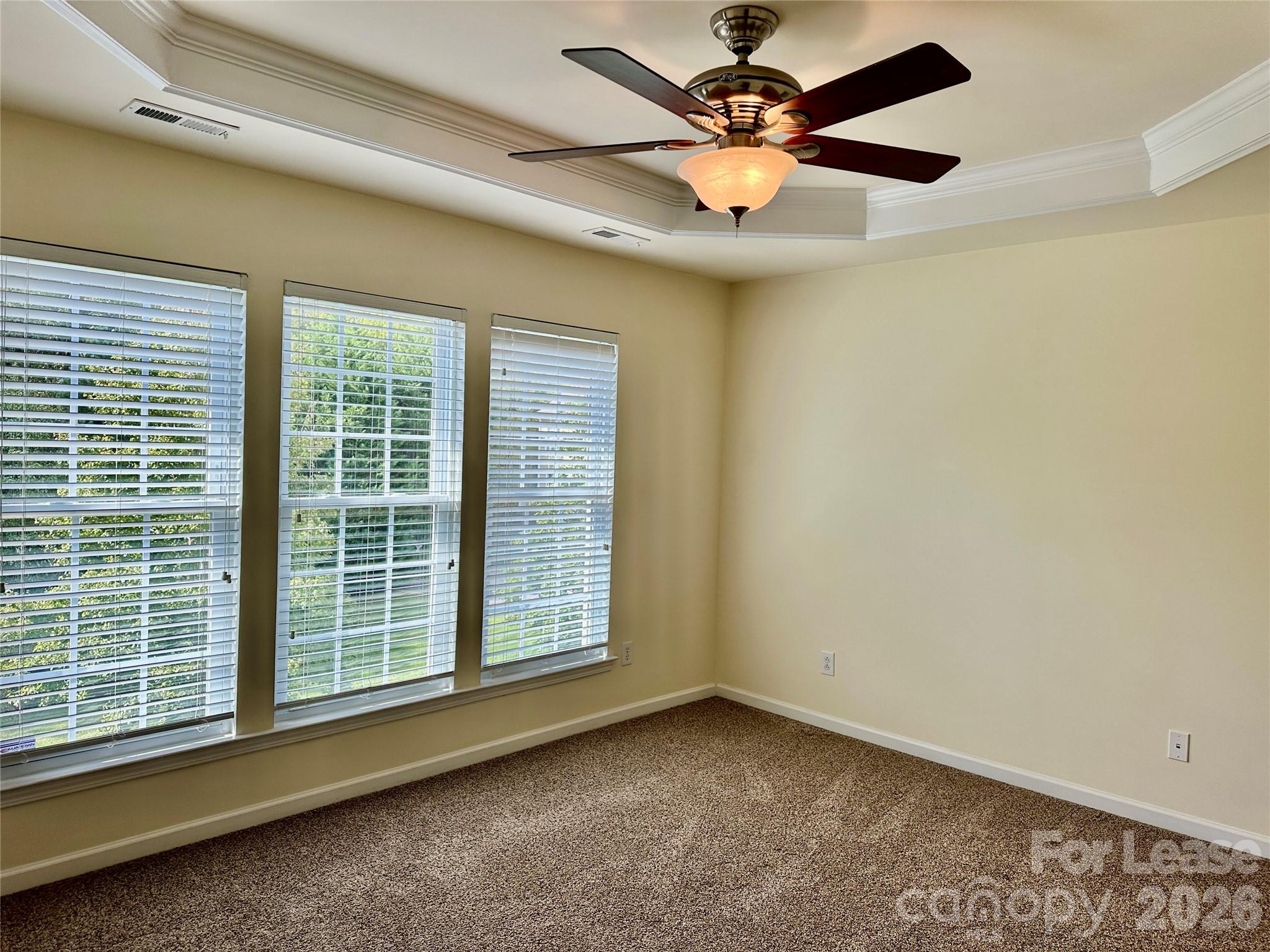 1104 Drayton Court Fort Mill, SC 29708 - Photo 11 of 20 an empty room with a window and a ceiling fan