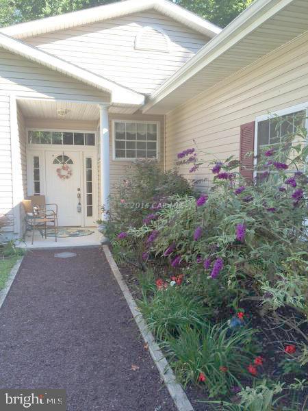 265 Windjammer Road Berlin, MD 21811 - Photo 3 of 26 a front view of a house with a yard