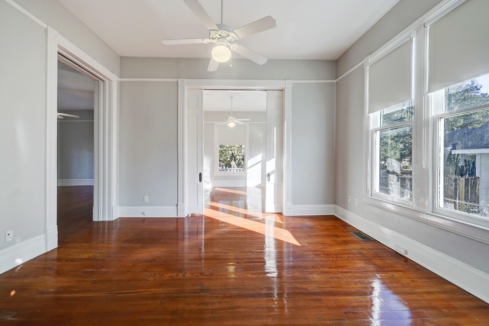 1229 Heights Boulevard Houston, TX 77008 - Photo 11 of 30 a view of an empty room with wooden floor and a window